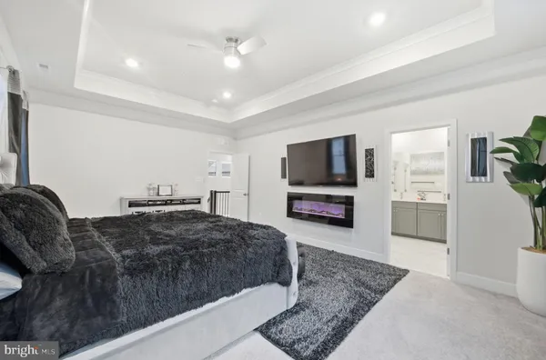 a spacious bathroom with a shower sink and mirror