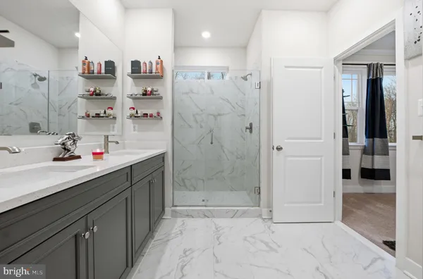 a bedroom with a bed dresser and a window