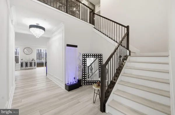 a view of a dining room with furniture and a wooden floor