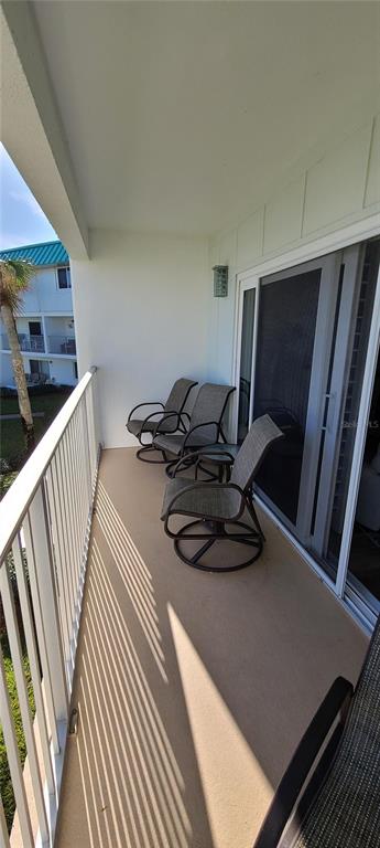 815 Ocean Shore Boulevard, Unit 7B Ormond Beach, FL 32176 - Photo 13 of 19 a view of a room with gym equipment