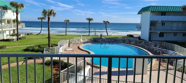 a view of a swimming pool with a patio