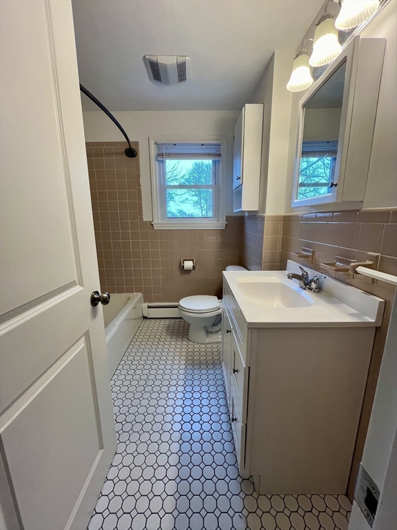 18 Guernsey Street, Unit 2 Marblehead, MA 01945 - Photo 17 of 23 a bathroom with a sink toilet and mirror