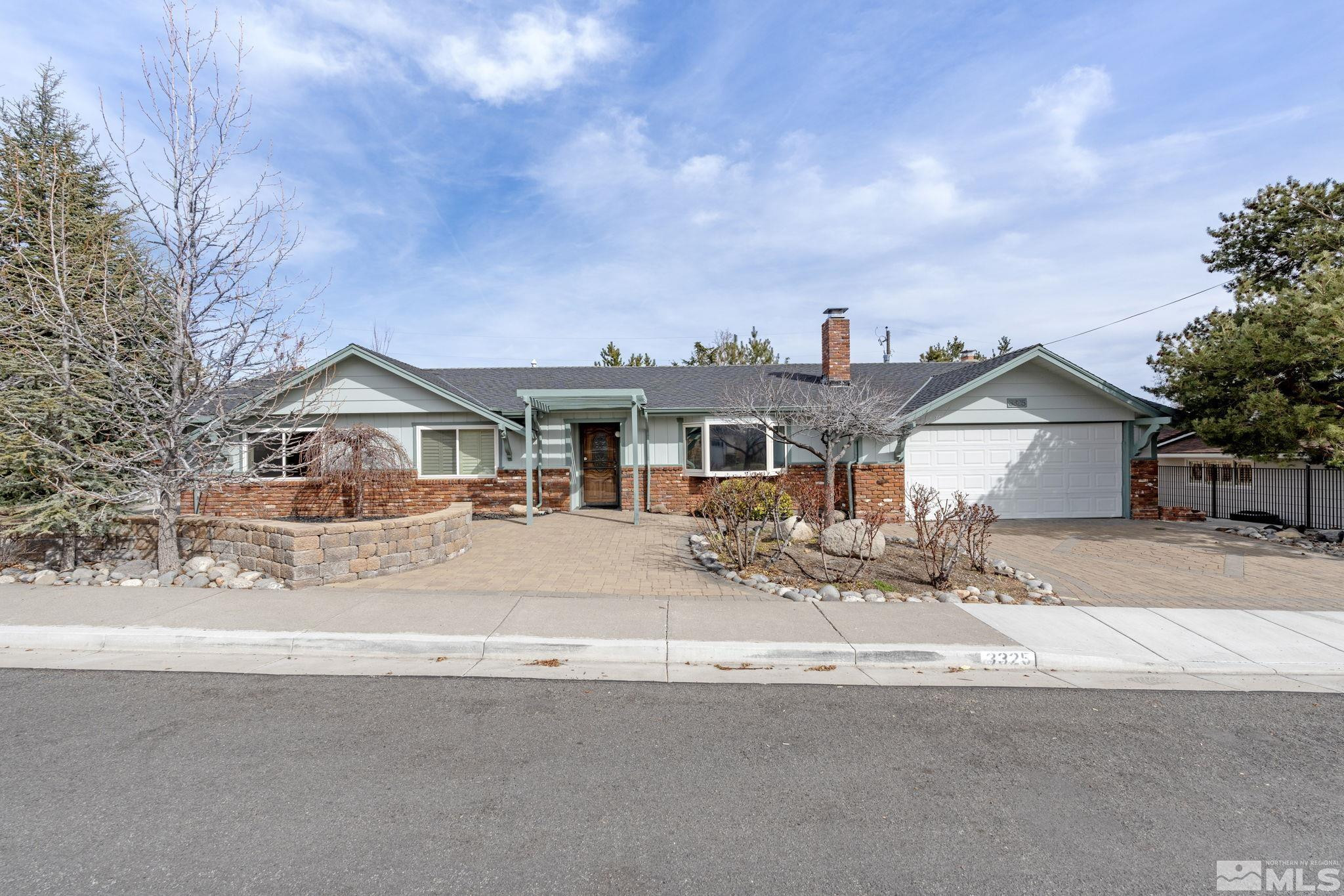 3325 Norman Drive Reno, NV 89509 - Photo 1 of 40 a view of a house with a street