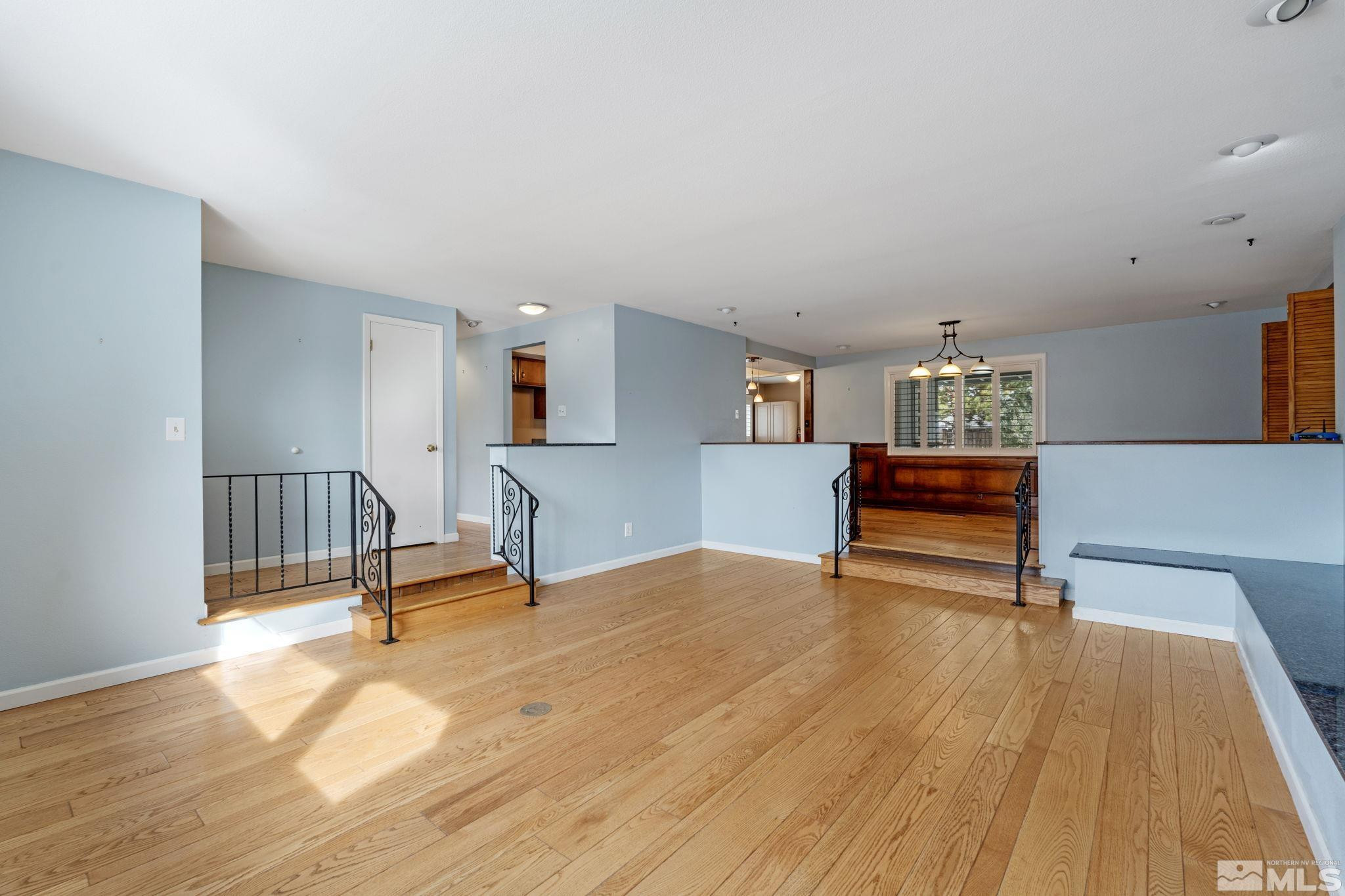 3325 Norman Drive Reno, NV 89509 - Photo 11 of 40 a view of a room with wooden floor and furniture