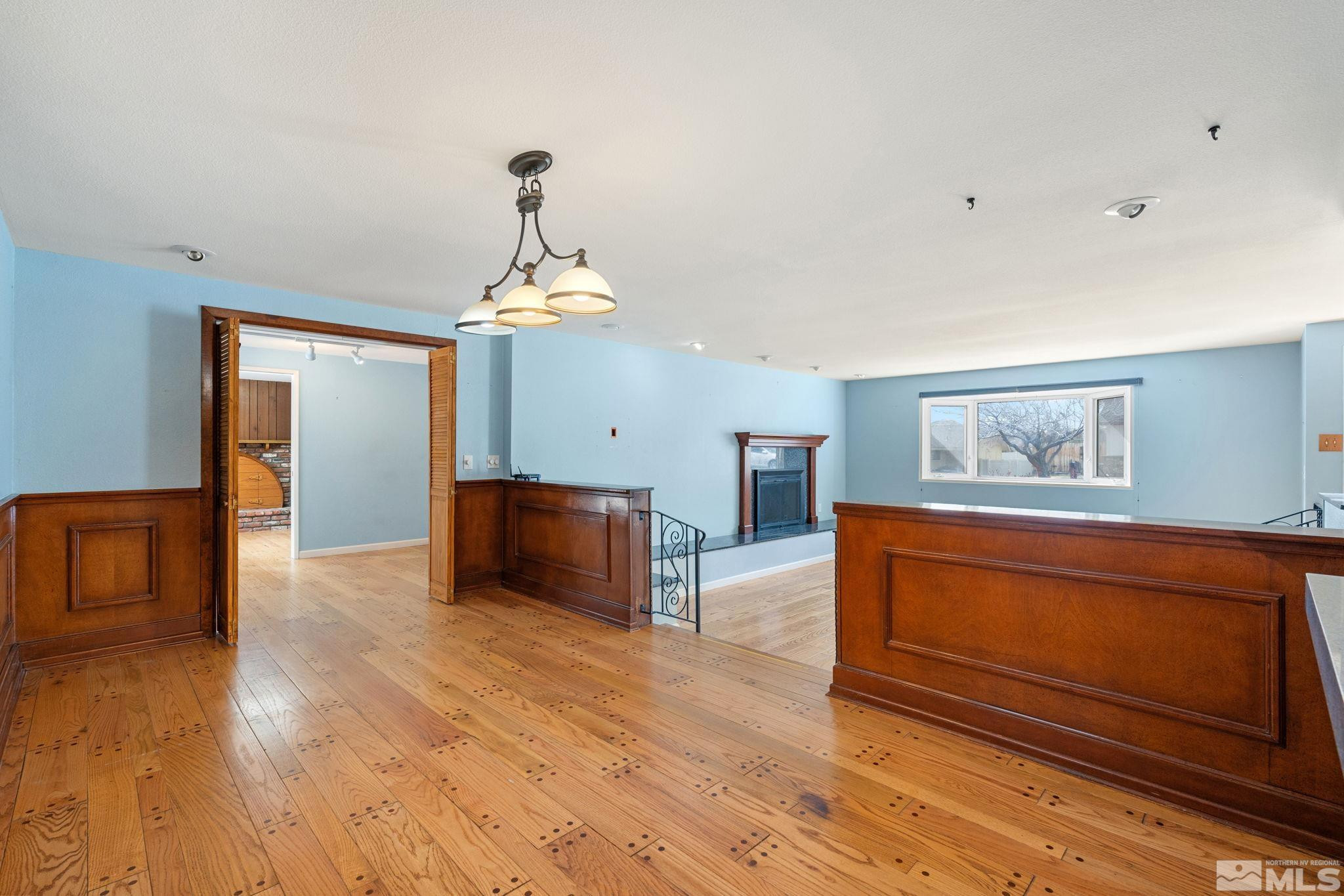 3325 Norman Drive Reno, NV 89509 - Photo 13 of 40 a living room with furniture and a chandelier