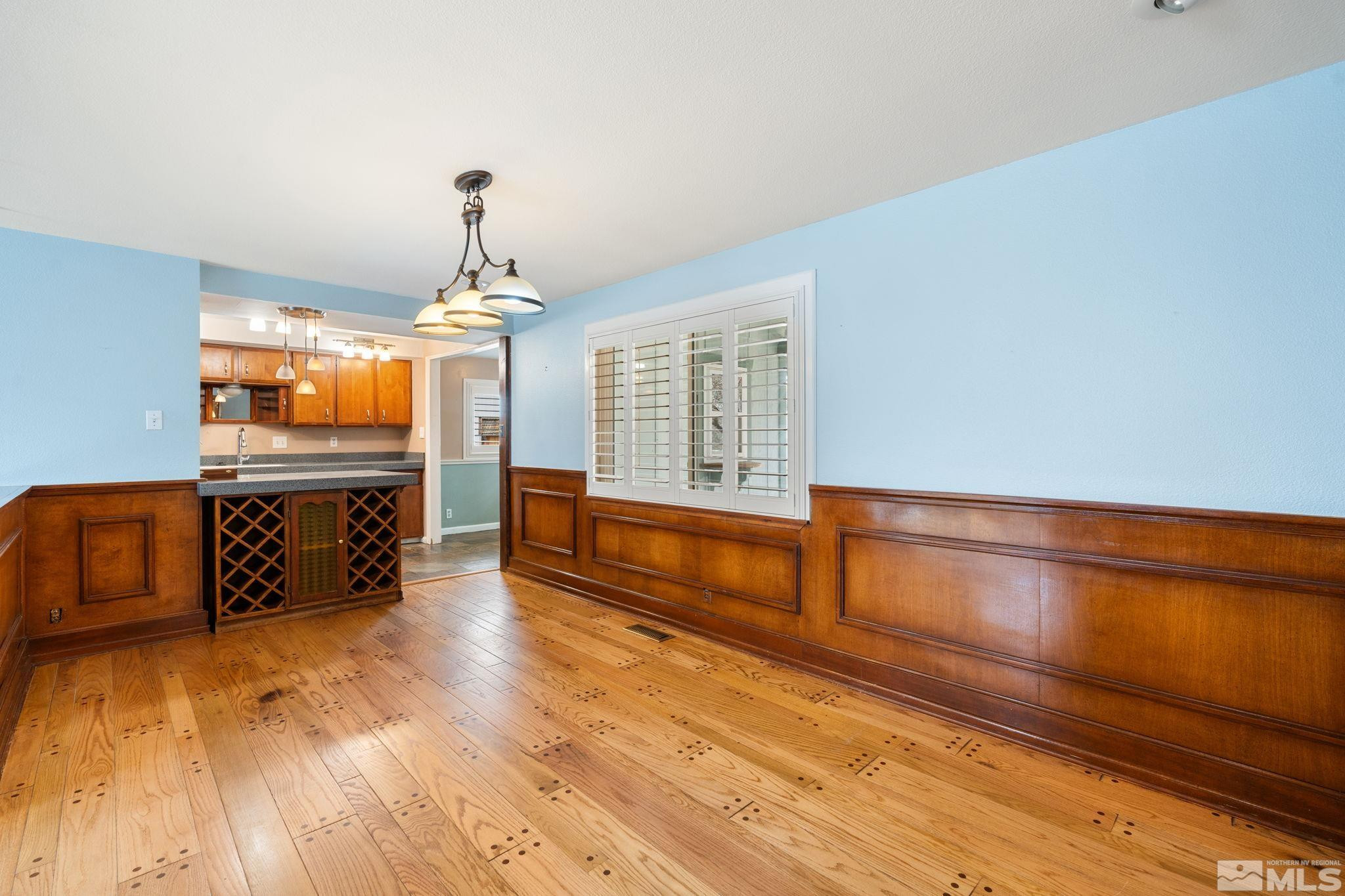 3325 Norman Drive Reno, NV 89509 - Photo 14 of 40 a large hall with wooden floor and a sink