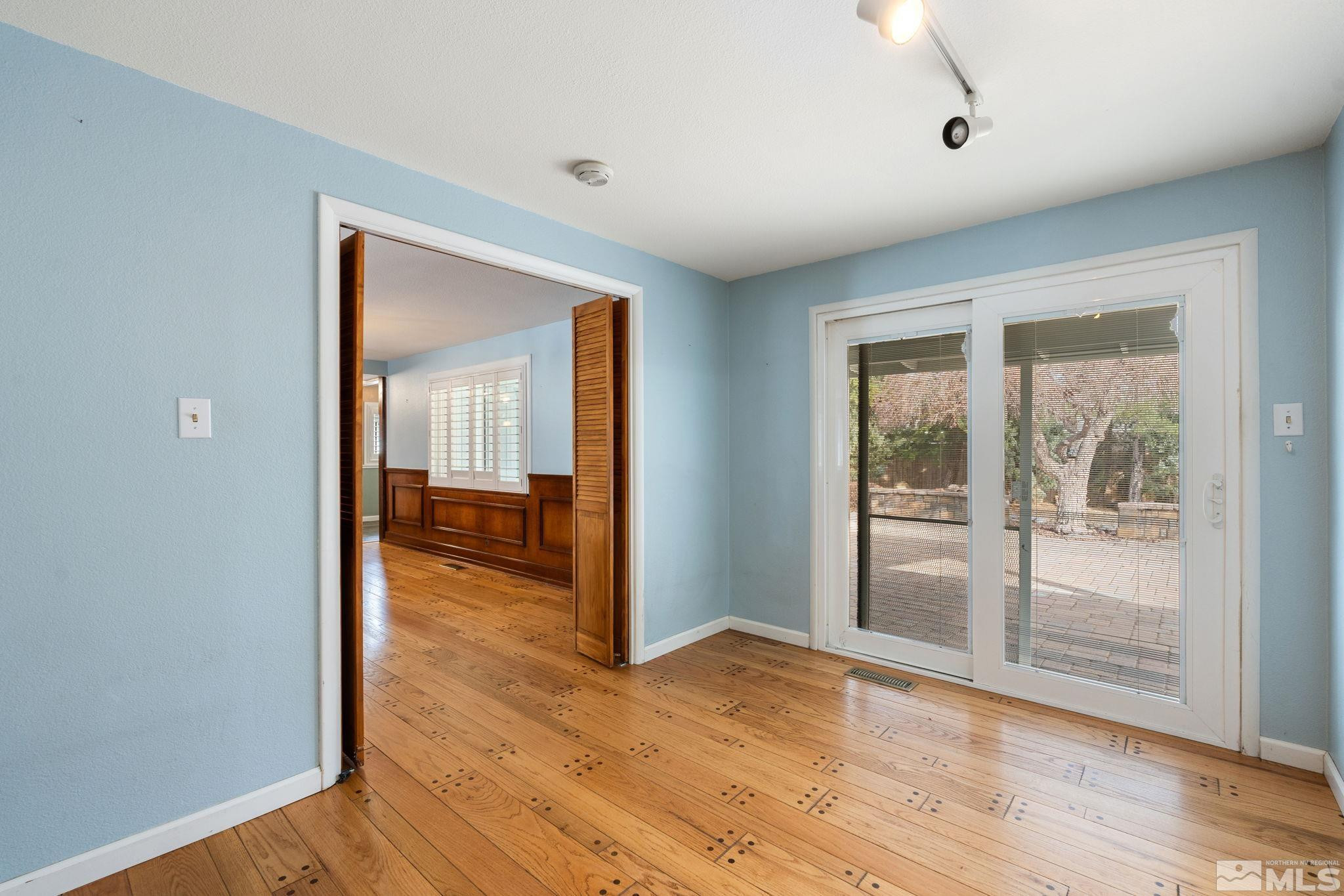 3325 Norman Drive Reno, NV 89509 - Photo 19 of 40 a view of a room with wooden floor and windows