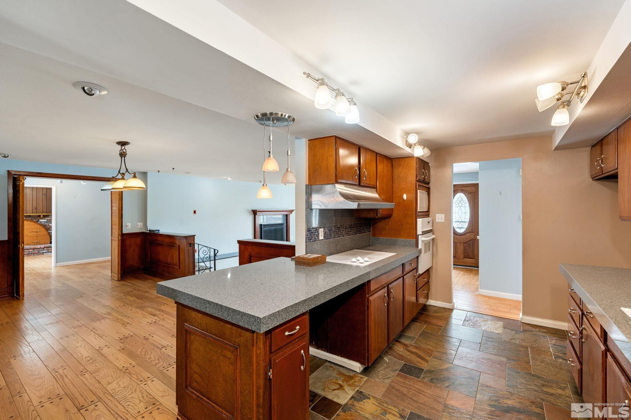 3325 Norman Drive Reno, NV 89509 - Photo 23 of 40 a kitchen with stainless steel appliances a sink and a refrigerator