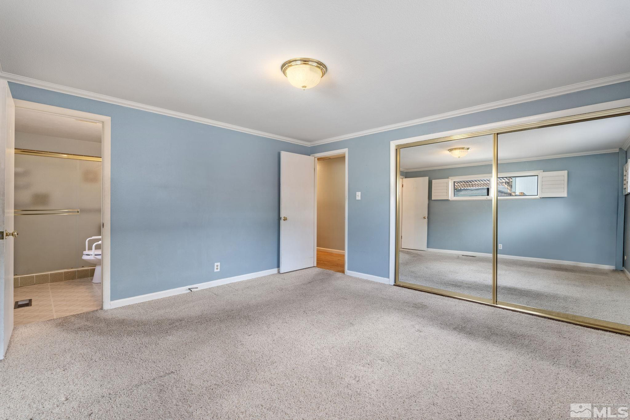 3325 Norman Drive Reno, NV 89509 - Photo 28 of 40 an empty room with sliding glass door and shower