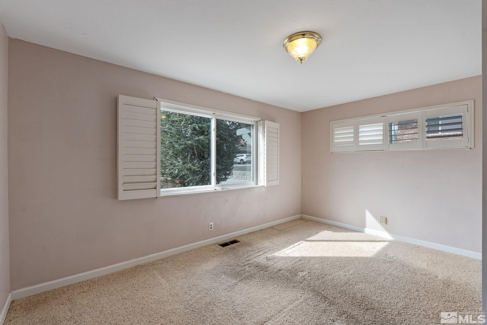 3325 Norman Drive Reno, NV 89509 - Photo 30 of 40 a view of an empty room with window and with furniture