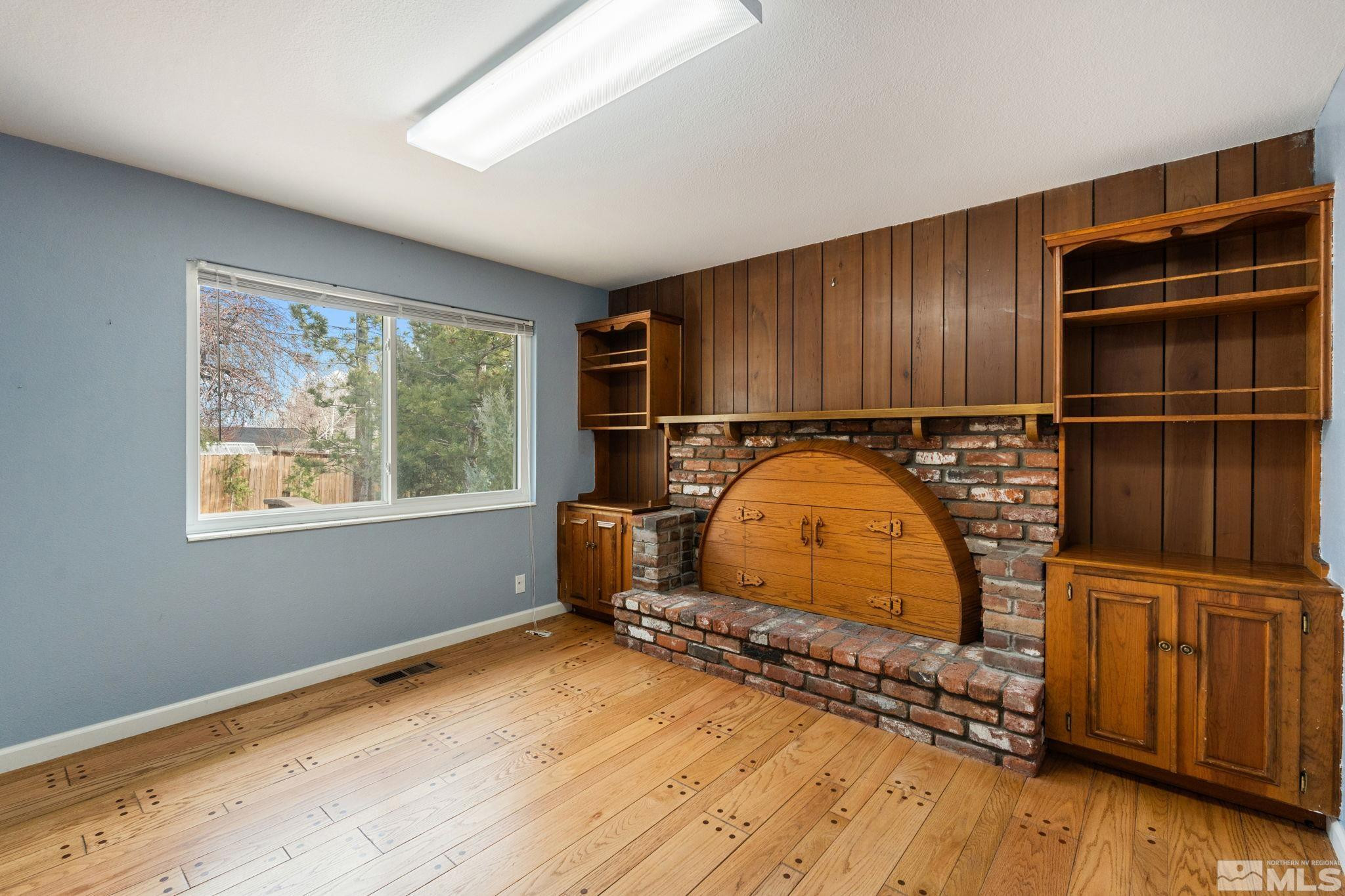 3325 Norman Drive Reno, NV 89509 - Photo 3 of 40 a view of room with window and wooden floor