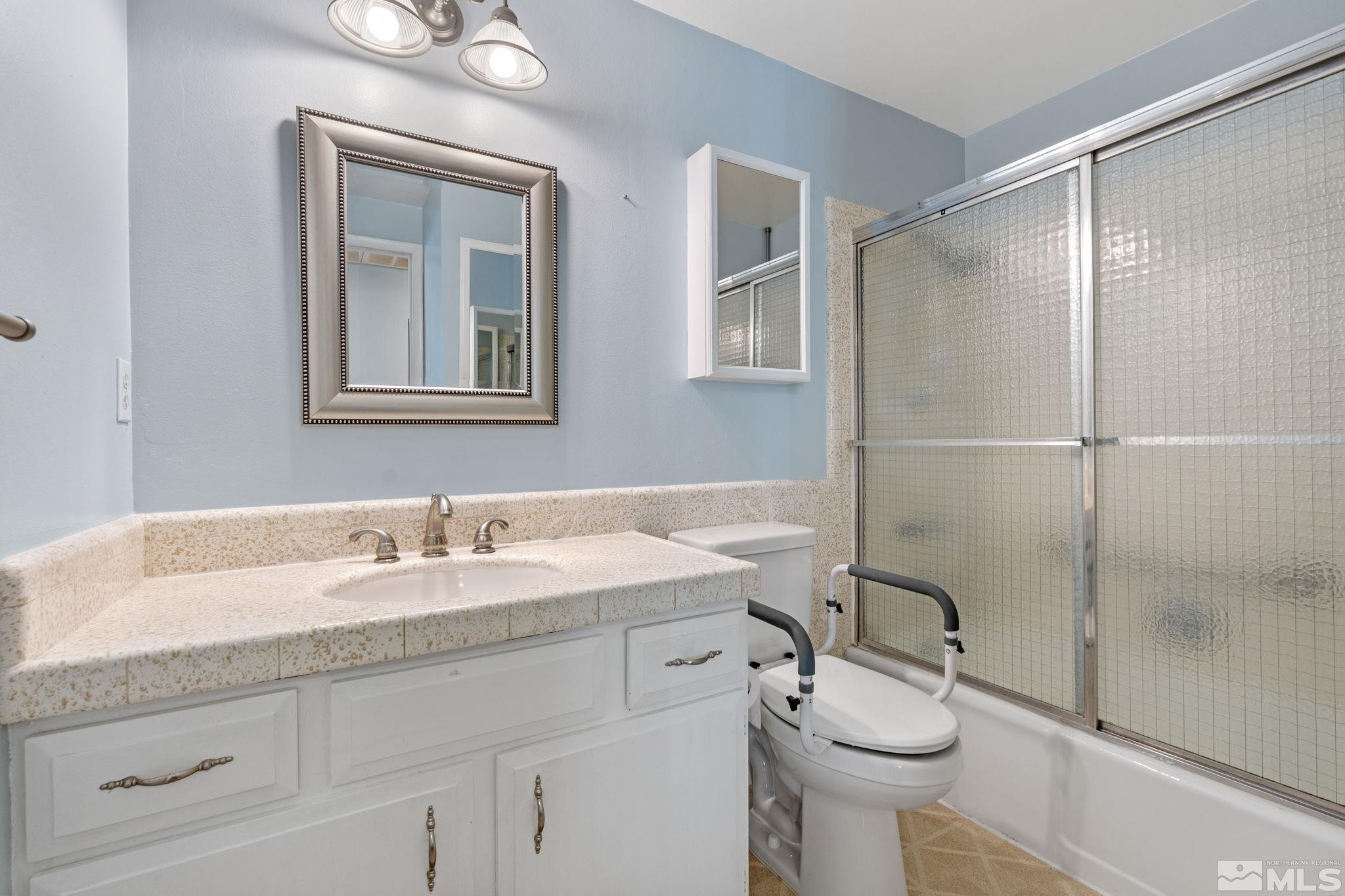 3325 Norman Drive Reno, NV 89509 - Photo 32 of 40 a bathroom with a sink toilet and shower
