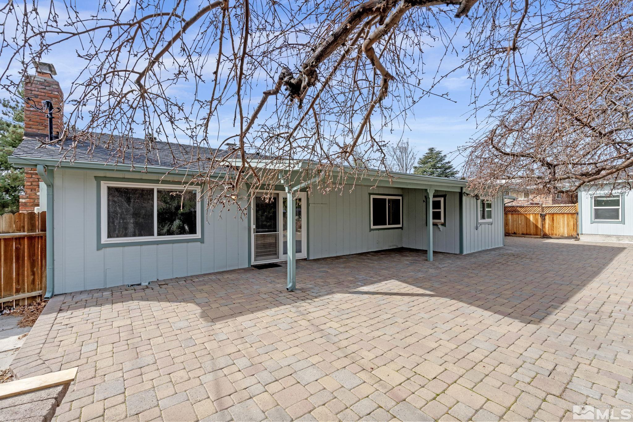 3325 Norman Drive Reno, NV 89509 - Photo 35 of 40 a front view of a house with a yard and a garage