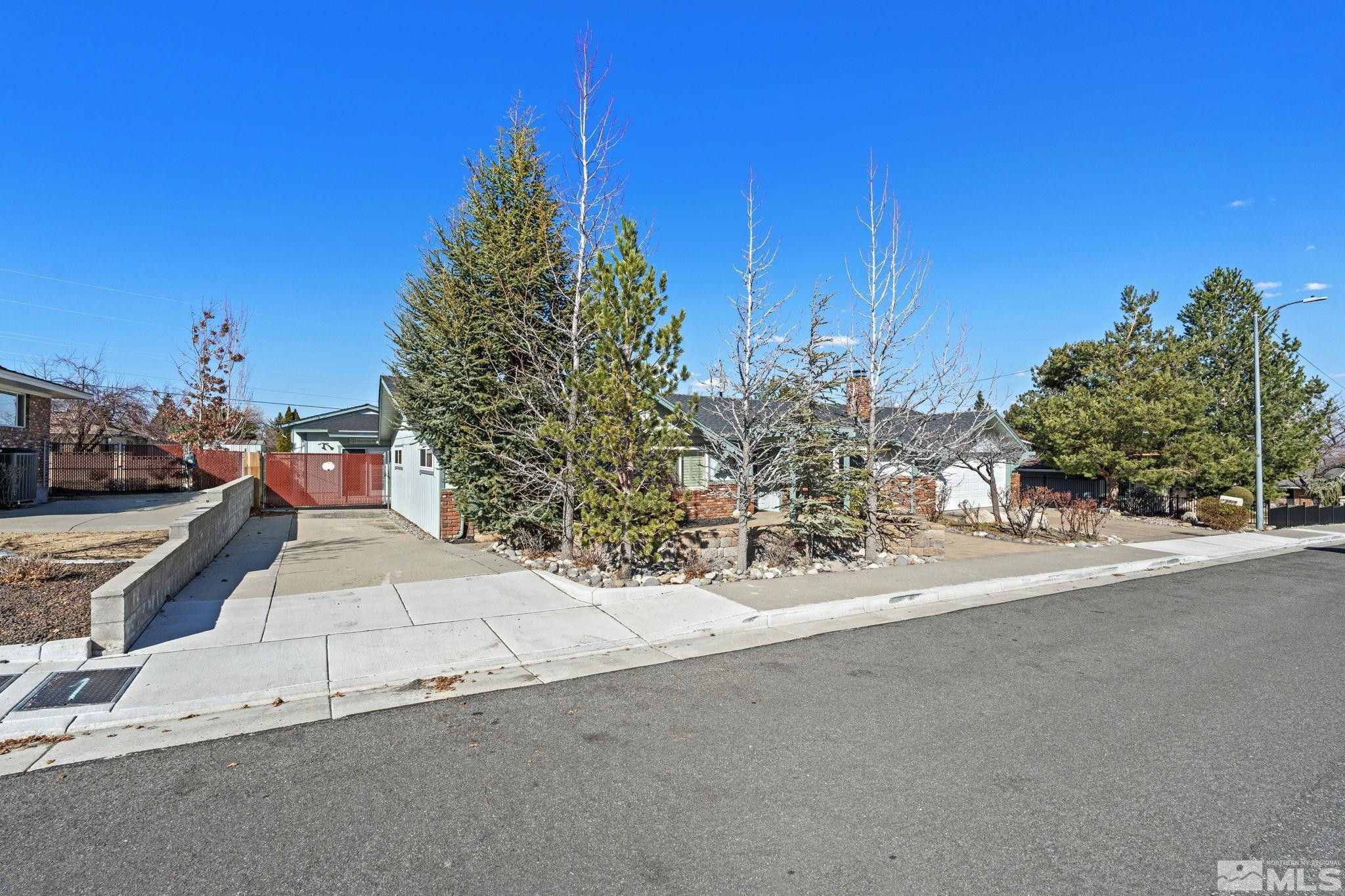 3325 Norman Drive Reno, NV 89509 - Photo 7 of 40 a view of a street with a building in the background