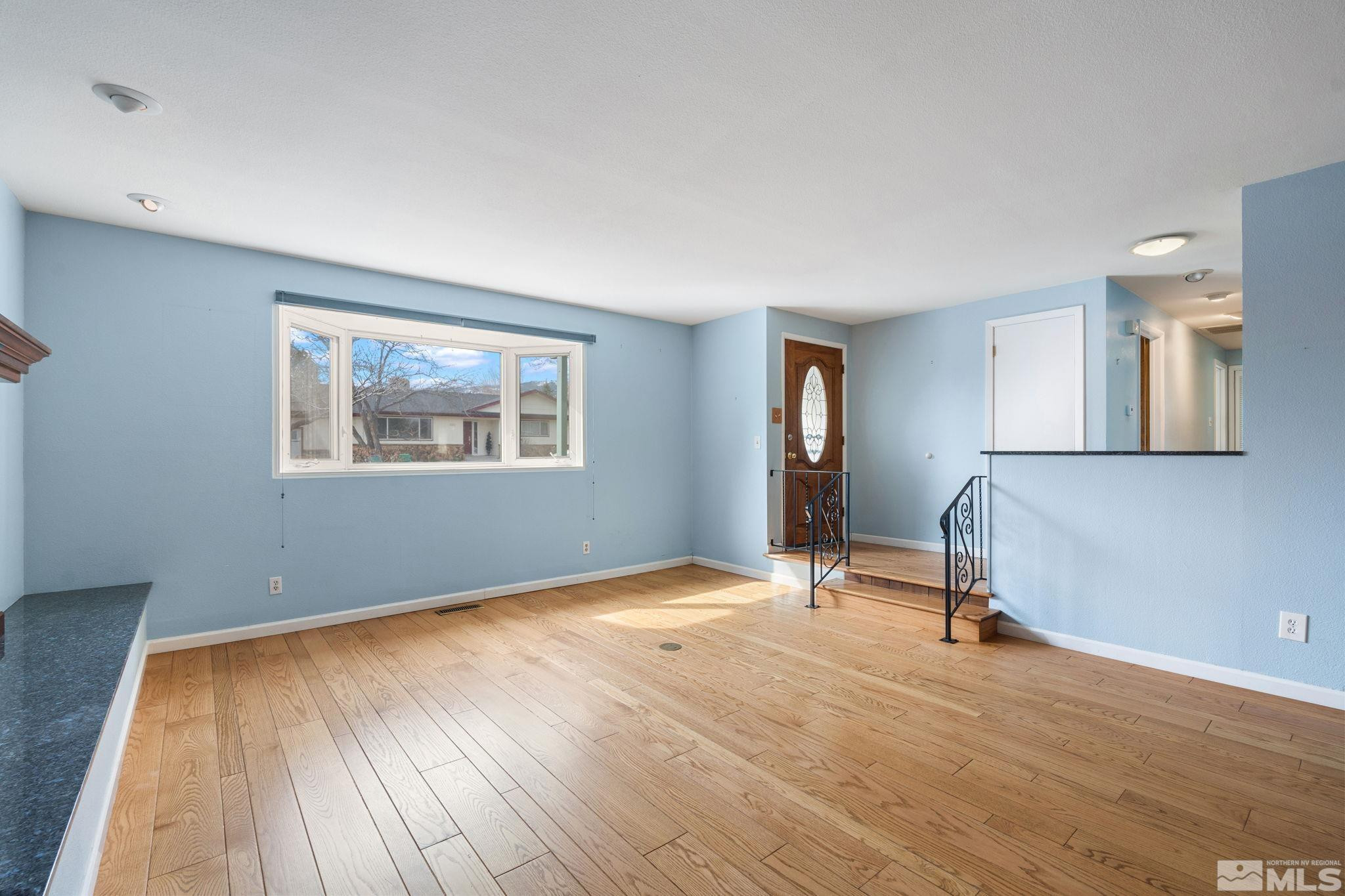 3325 Norman Drive Reno, NV 89509 - Photo 9 of 40 a view of a room with wooden floor and windows