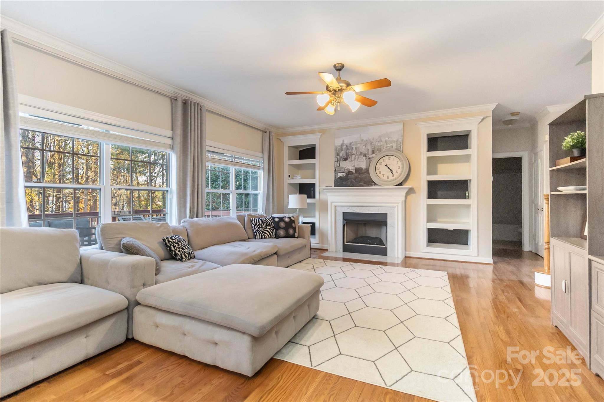 1608 Copperplate Road Charlotte, NC 28262 - Photo 18 of 31 a living room with furniture a fireplace and a large window