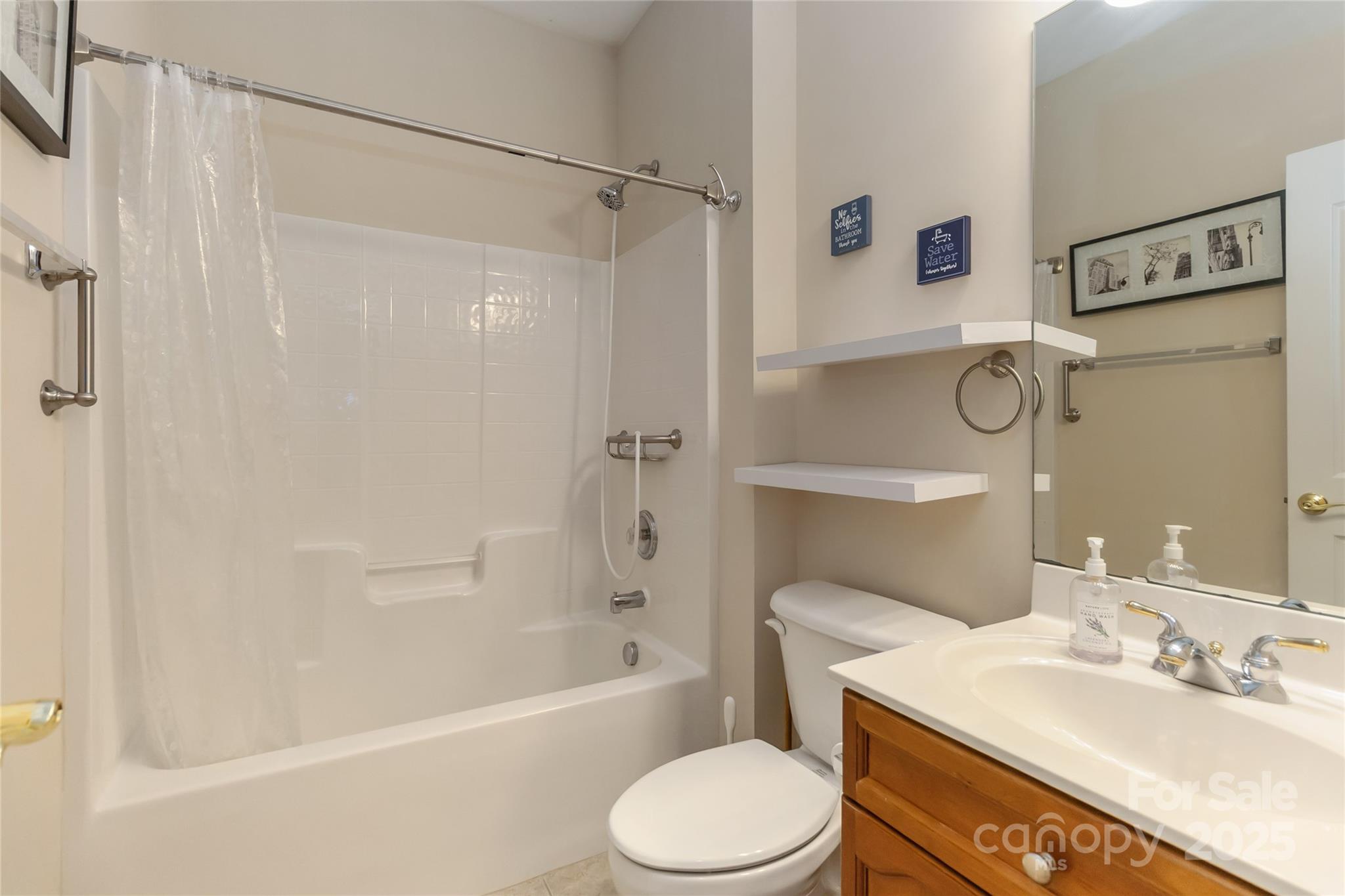 1608 Copperplate Road Charlotte, NC 28262 - Photo 19 of 31 a bathroom with a sink toilet and shower