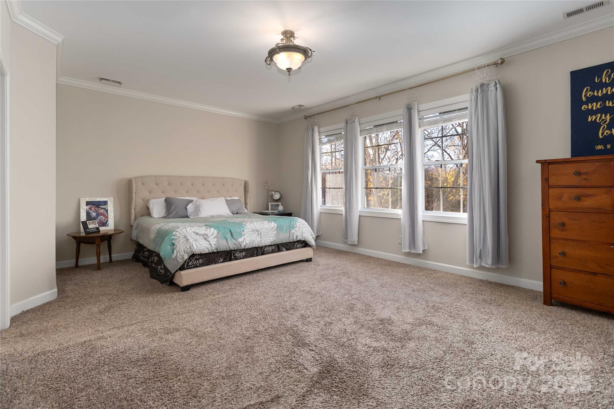 1608 Copperplate Road Charlotte, NC 28262 - Photo 21 of 31 a bedroom with a bed and a cabinets
