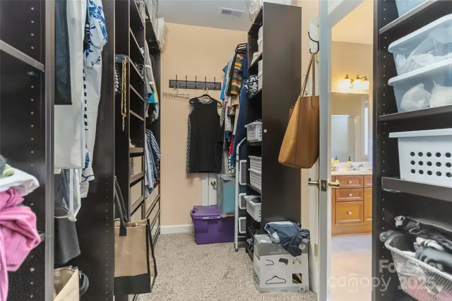a spacious bathroom with a granite countertop sink mirror and a bathtub