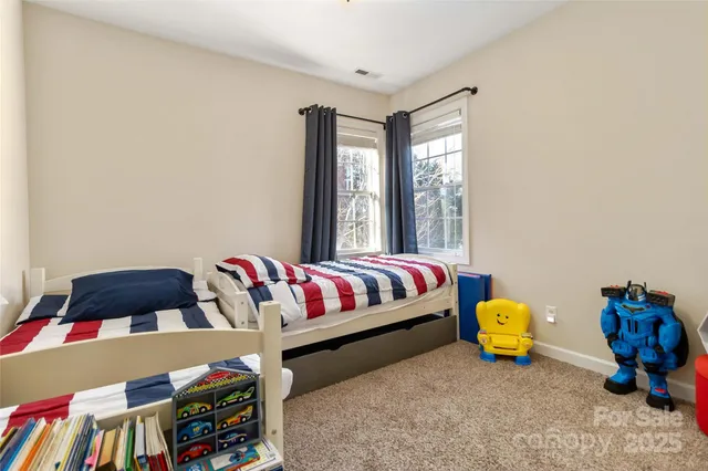 a spacious bathroom with a double vanity sink a large mirror and a shower