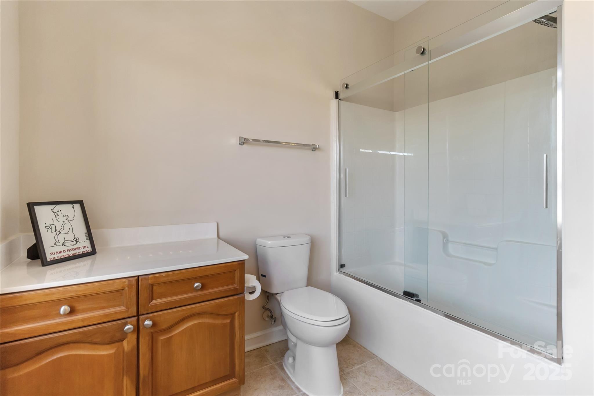1608 Copperplate Road Charlotte, NC 28262 - Photo 30 of 31 a bathroom with a granite countertop toilet and a shower