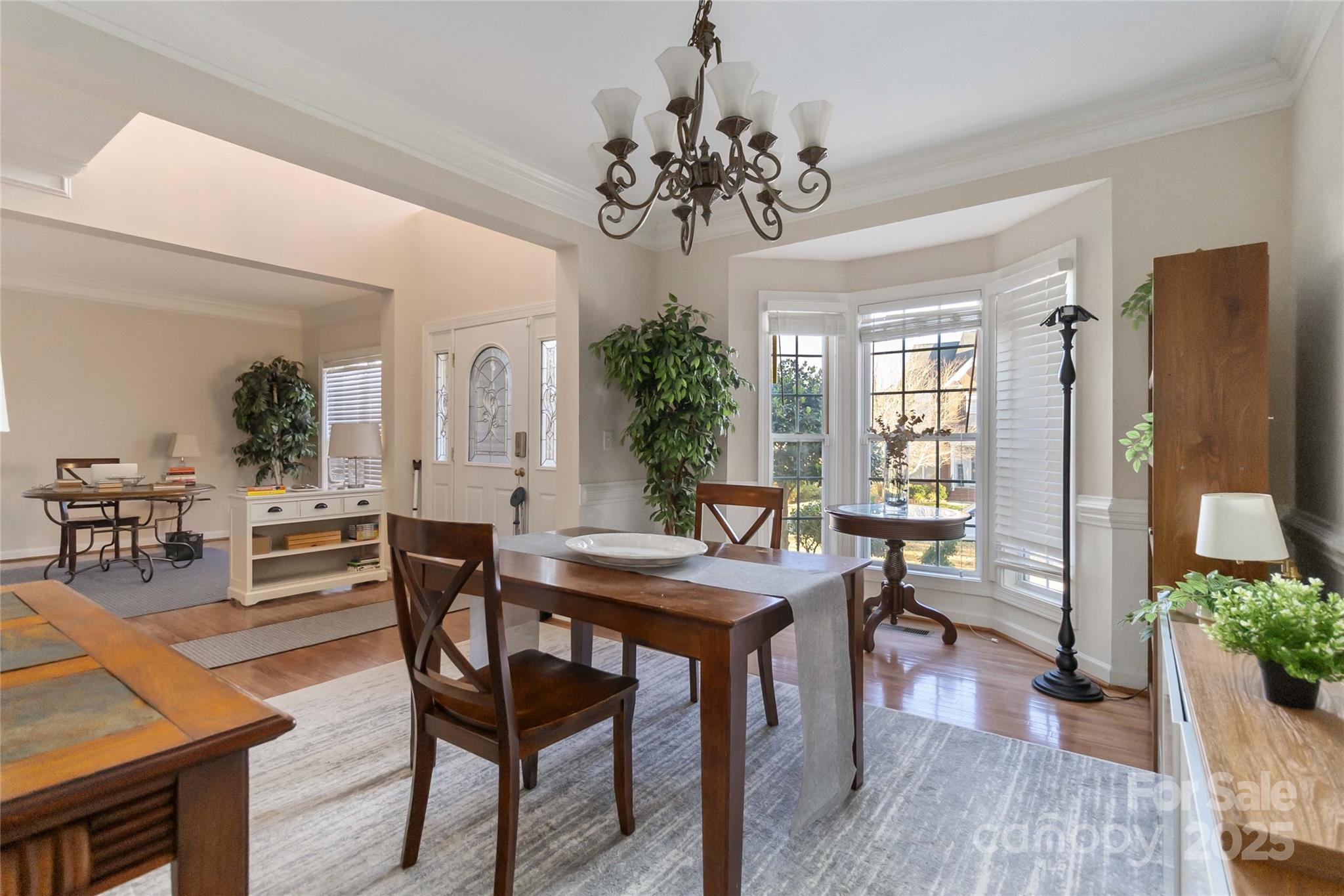 1608 Copperplate Road Charlotte, NC 28262 - Photo 10 of 31 a view of a dining room with furniture and wooden floor