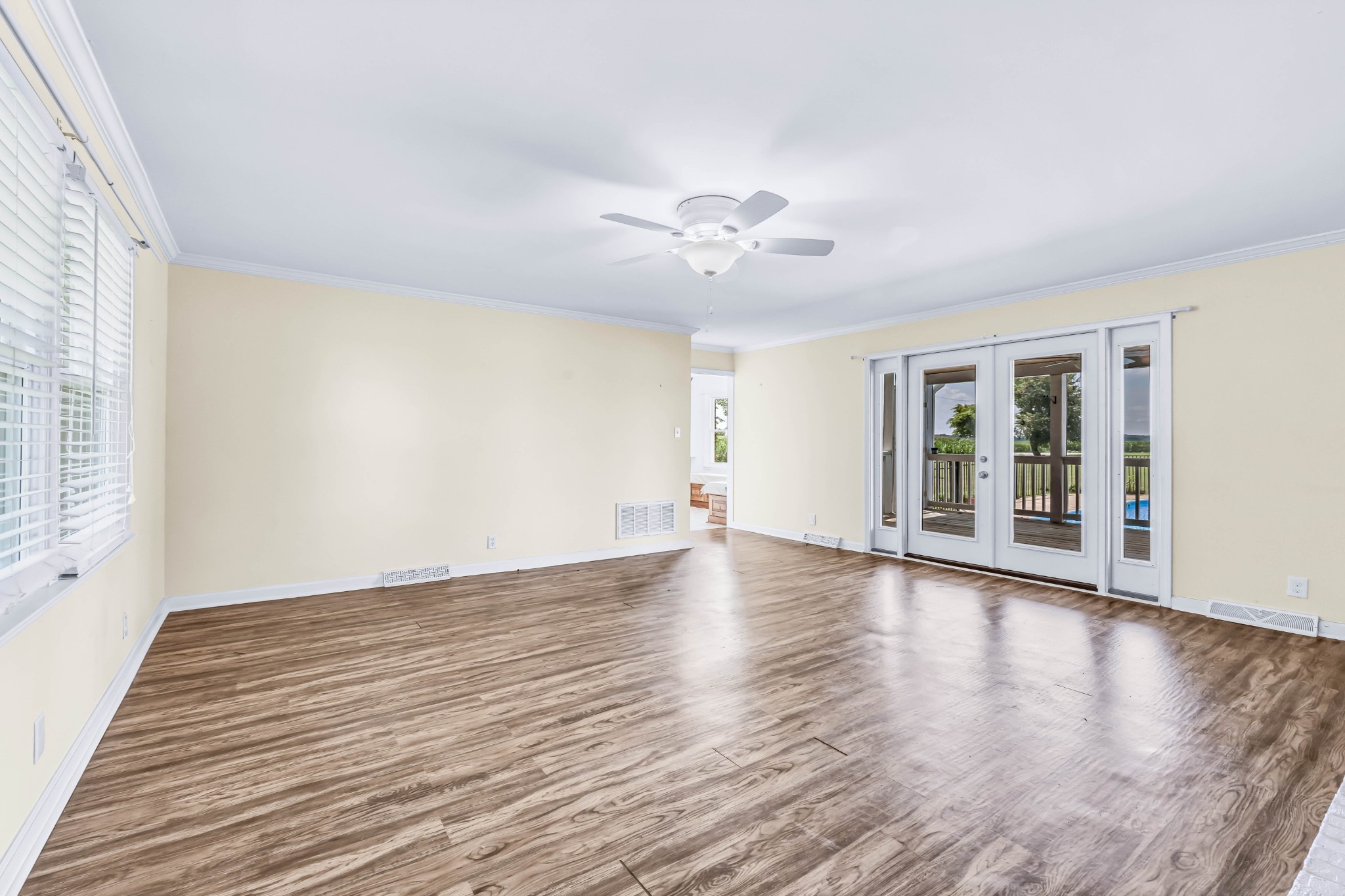 511 Snardon Mill Road Allensville, KY 42204 - Photo 17 of 44 a view of an empty room with a window and wooden floor