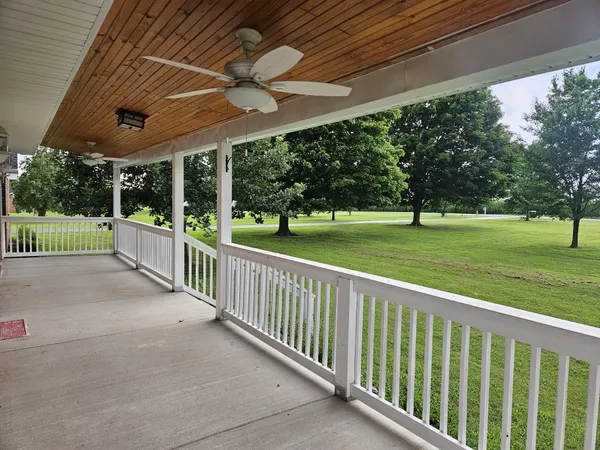a view of a porch and garden