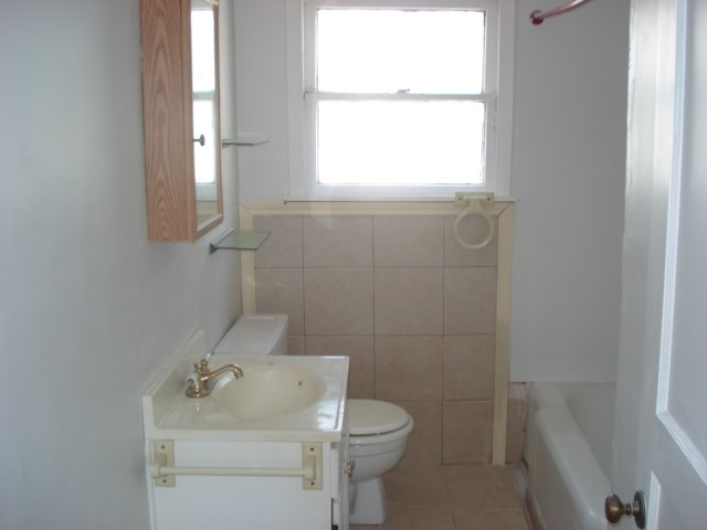 625 Everhart Road Corpus Christi, TX 78412 - Photo 5 of 8 a bathroom with a toilet sink and mirror
