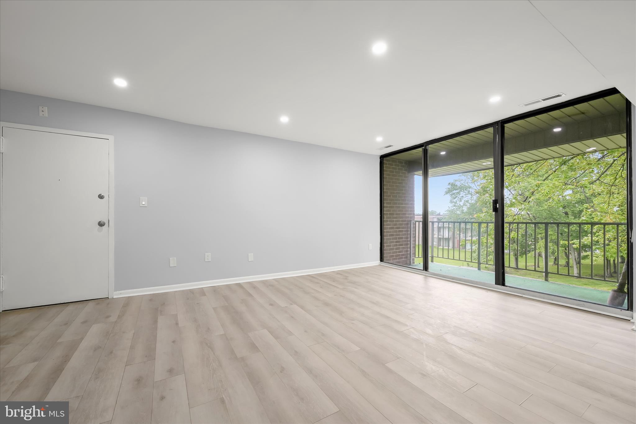 7967 Riggs Road, Unit 796710 Hyattsville, MD 20783 - Photo 7 of 29 Living Room - Balcony Access