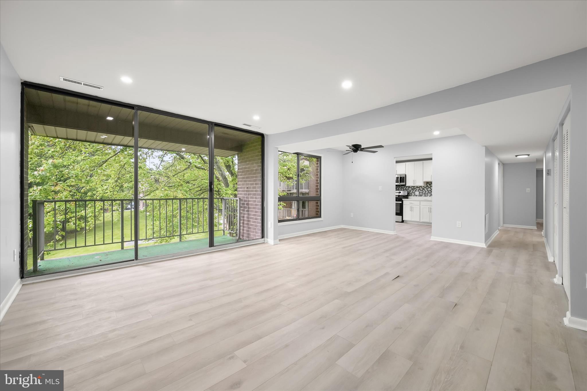 7967 Riggs Road, Unit 796710 Hyattsville, MD 20783 - Photo 8 of 29 Living - Dining - Balcony
