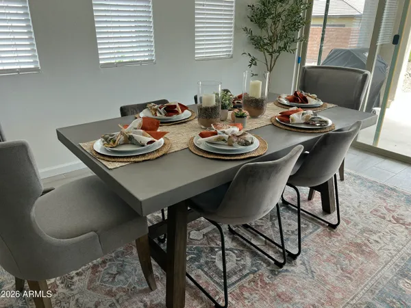 a view of a dining table and chairs in the floor