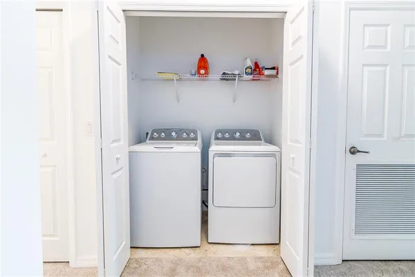 a outdoor living space with furniture and a rug