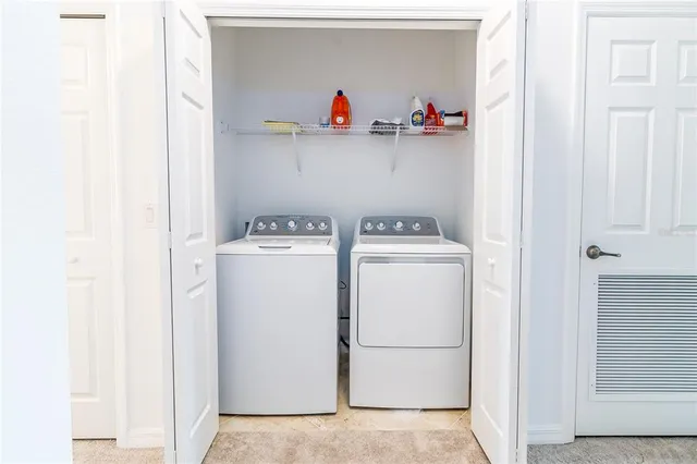 a outdoor living space with furniture and a rug