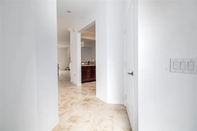 a view of a bathroom from a hallway