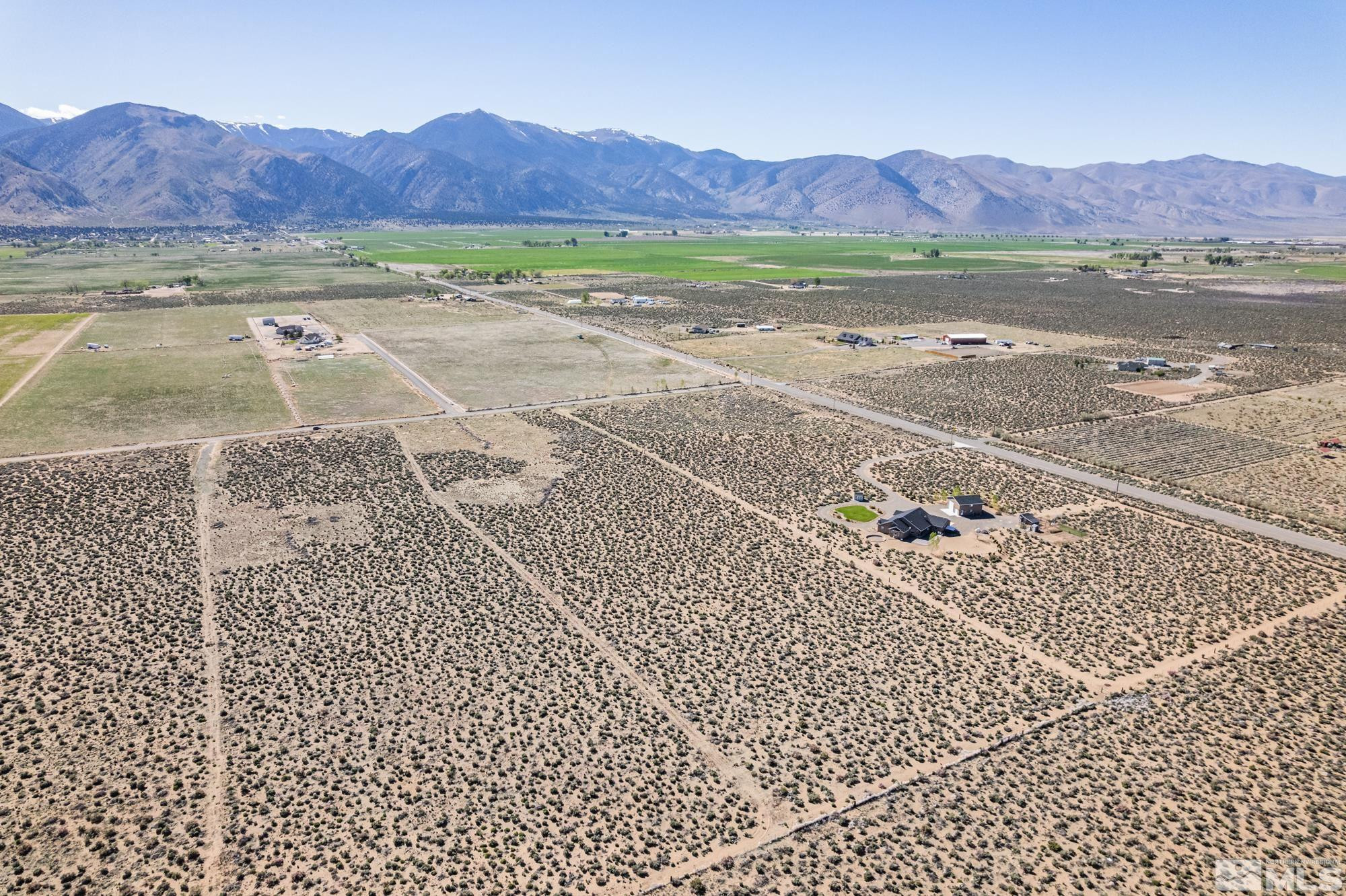 16 Hawk View Road Wellington, NV 89444 - Photo 5 of 19 a view of a back yard of a house with a yard
