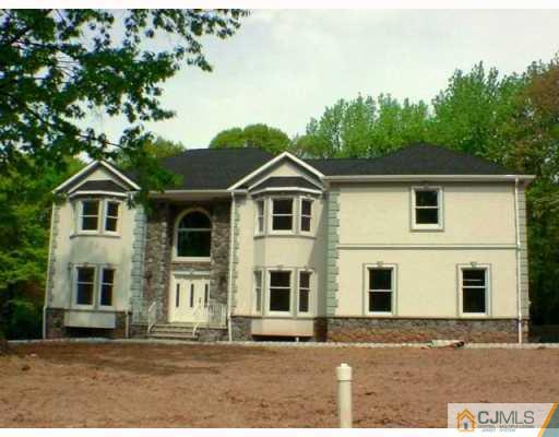 2 Stark Place Edison, NJ 08820 - Photo 1 of 10 a front view of a house with a yard