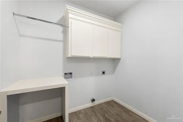 a room with a sink and cabinets