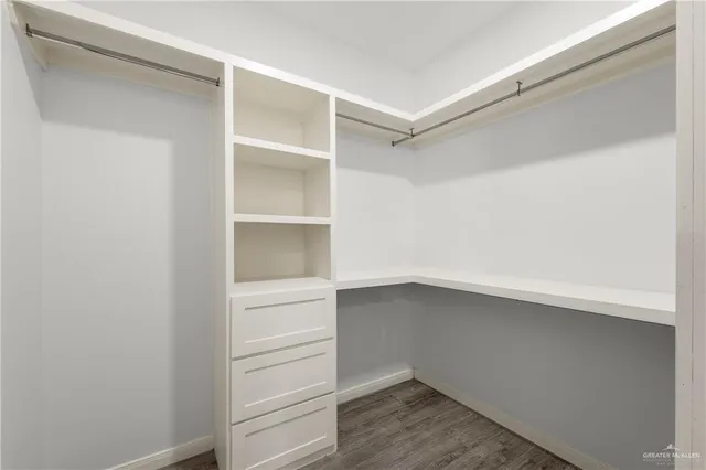 a view of an empty walk in closet