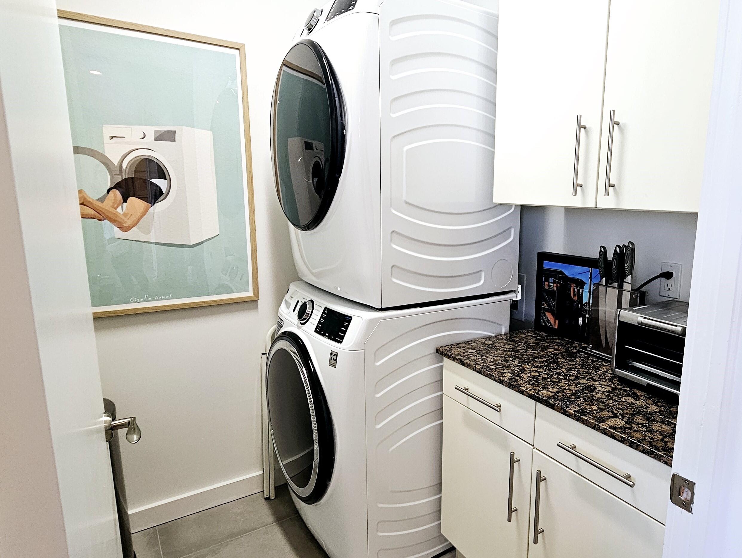 365 Southeast 6th Avenue, Unit 305 Delray Beach, FL 33483 - Photo 11 of 49 a utility room with dryer and washer