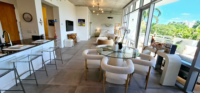 a view of a dining room with furniture window and outside view