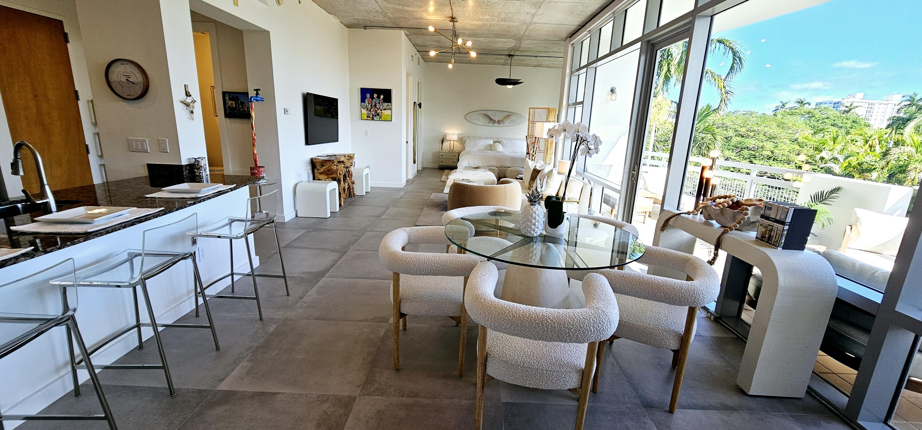 365 Southeast 6th Avenue, Unit 305 Delray Beach, FL 33483 - Photo 16 of 49 a view of a dining room with furniture window and outside view
