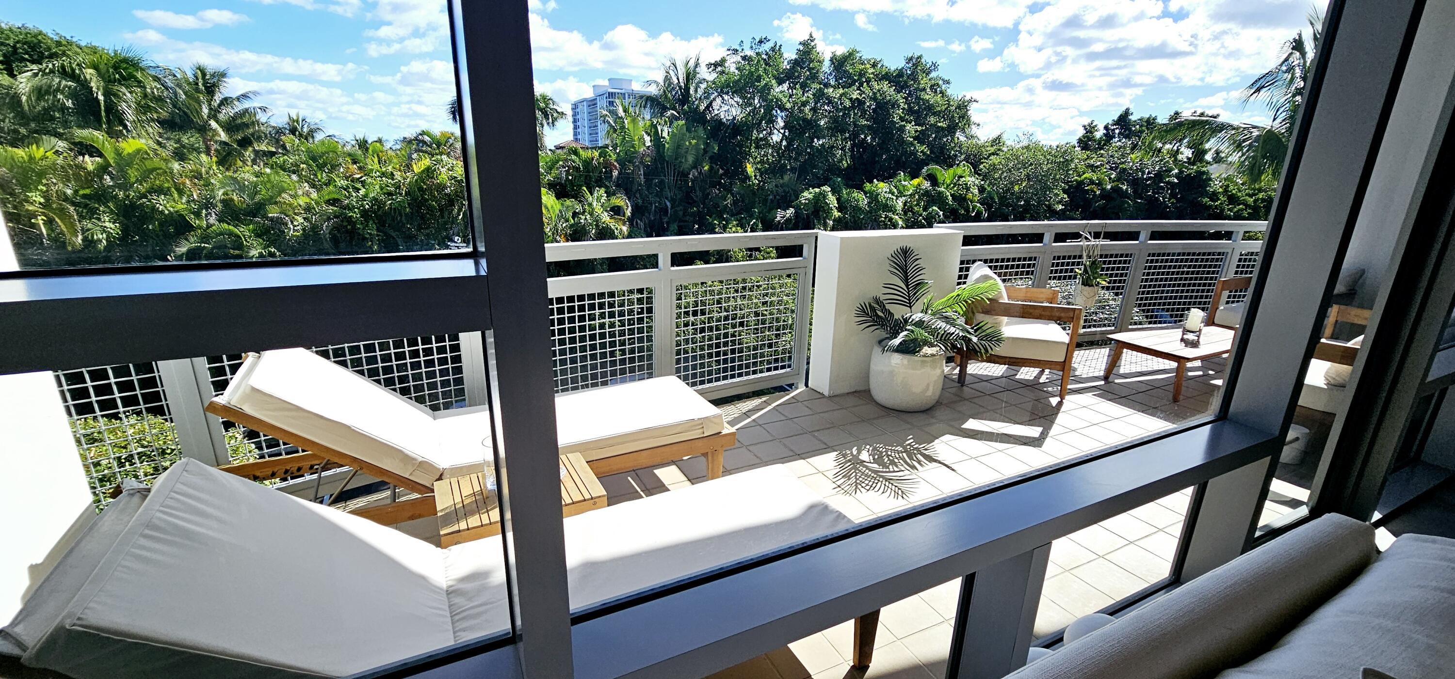 365 Southeast 6th Avenue, Unit 305 Delray Beach, FL 33483 - Photo 19 of 49 a view of swimming pool from a balcony