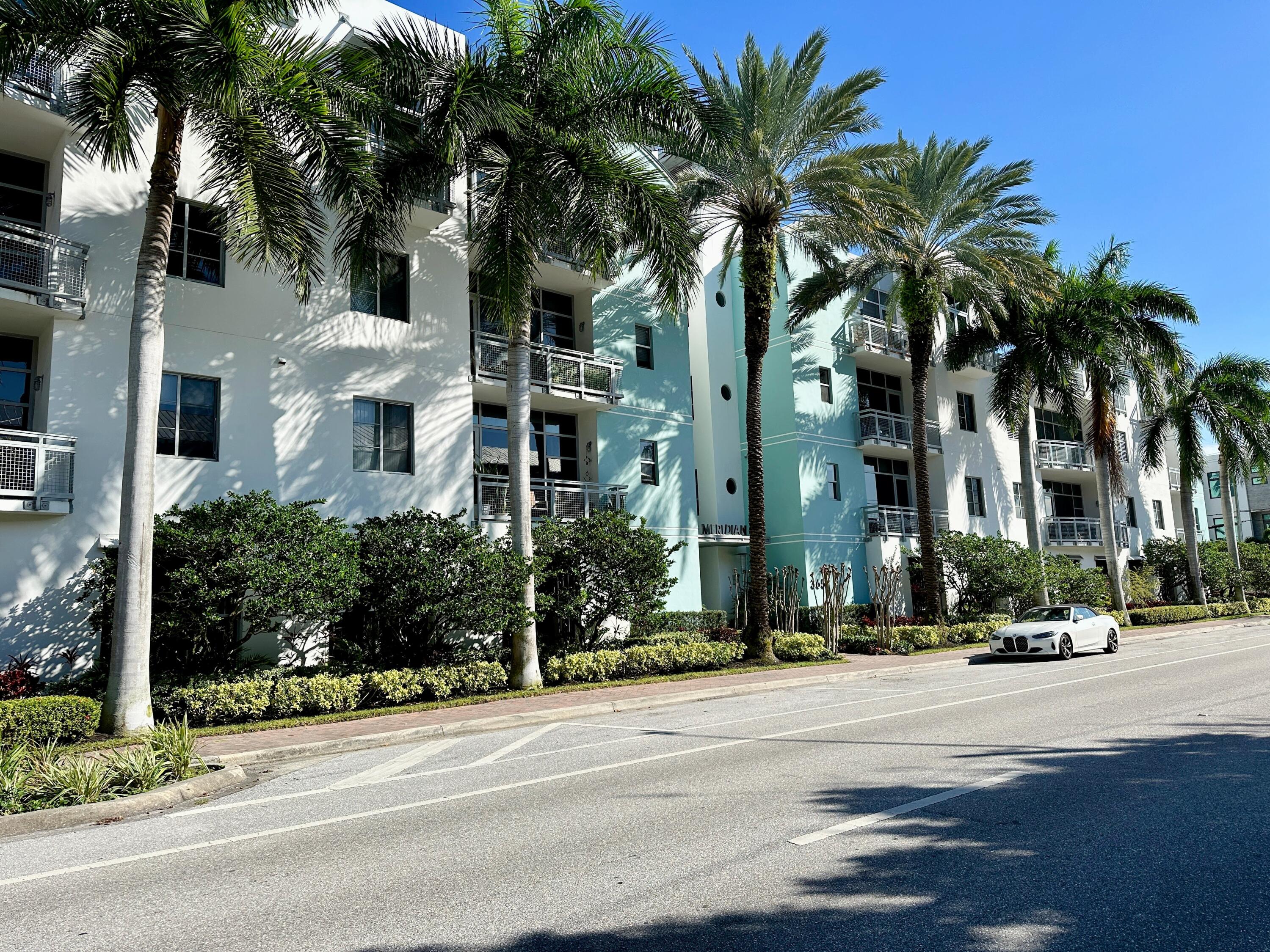 365 Southeast 6th Avenue, Unit 305 Delray Beach, FL 33483 - Photo 2 of 49 front view of multiple houses with a yard