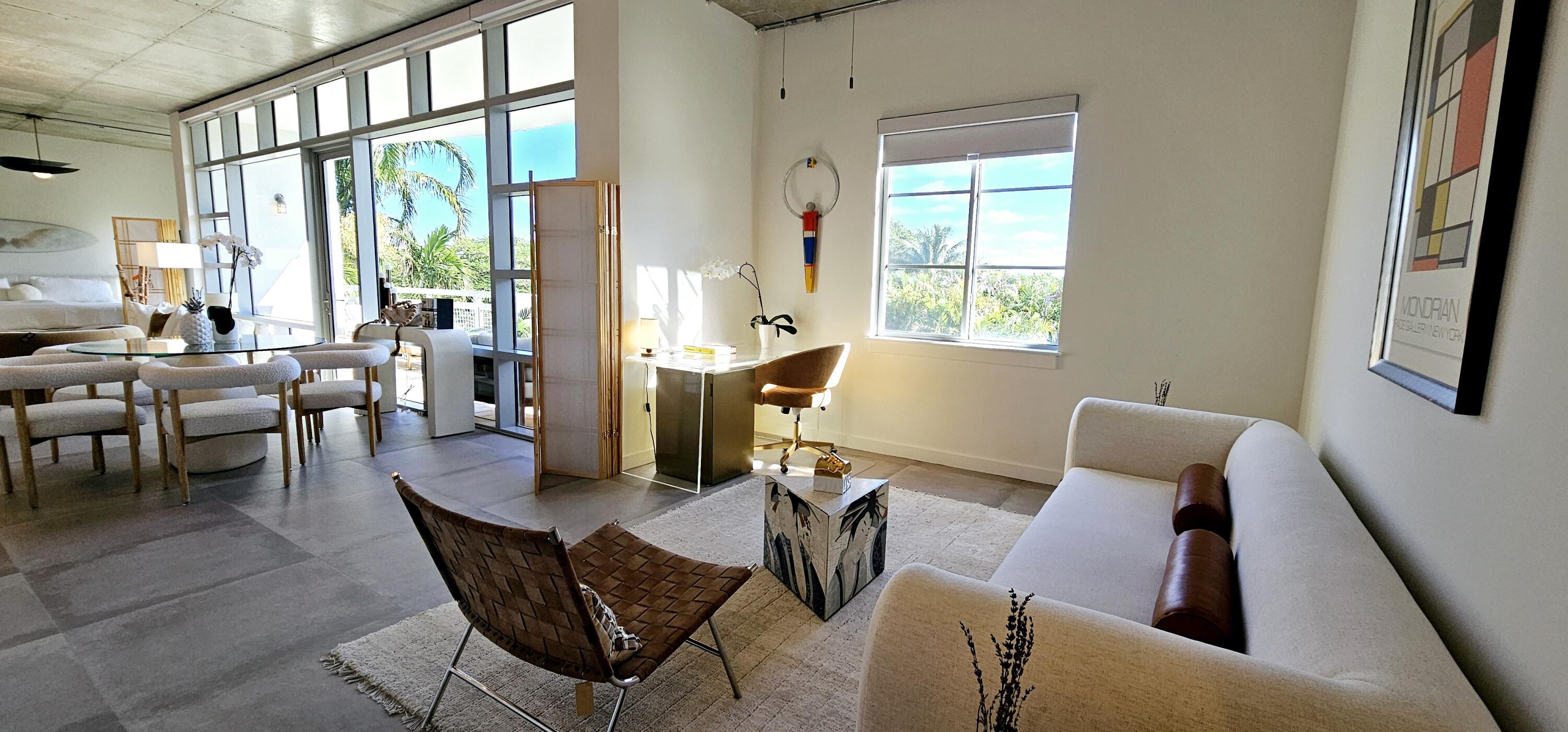 365 Southeast 6th Avenue, Unit 305 Delray Beach, FL 33483 - Photo 21 of 49 a living room with furniture and a window