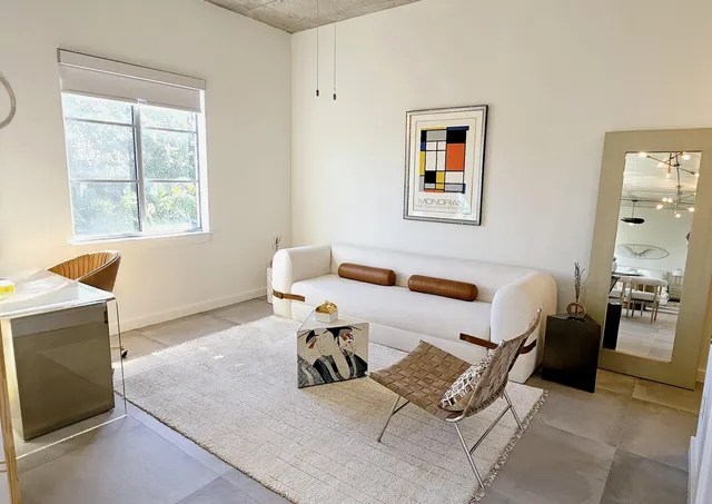 a living room with furniture and a window