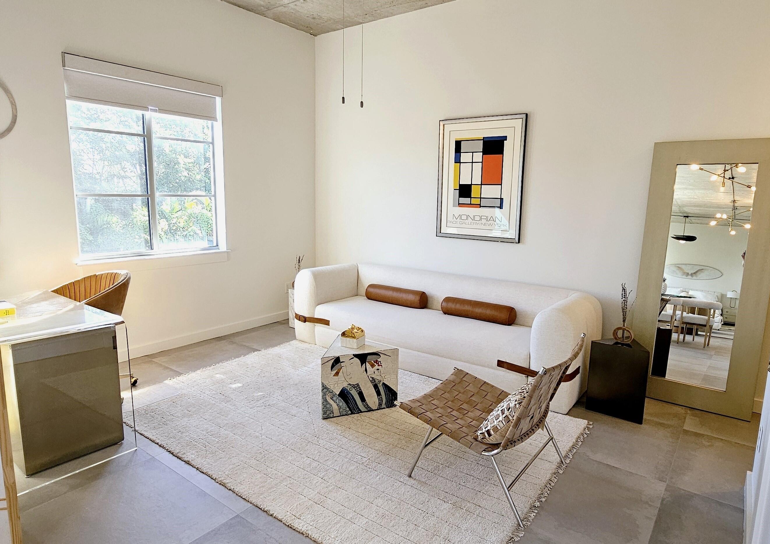 365 Southeast 6th Avenue, Unit 305 Delray Beach, FL 33483 - Photo 24 of 49 a living room with furniture and a window