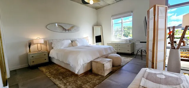 a bed room with a bed and a window