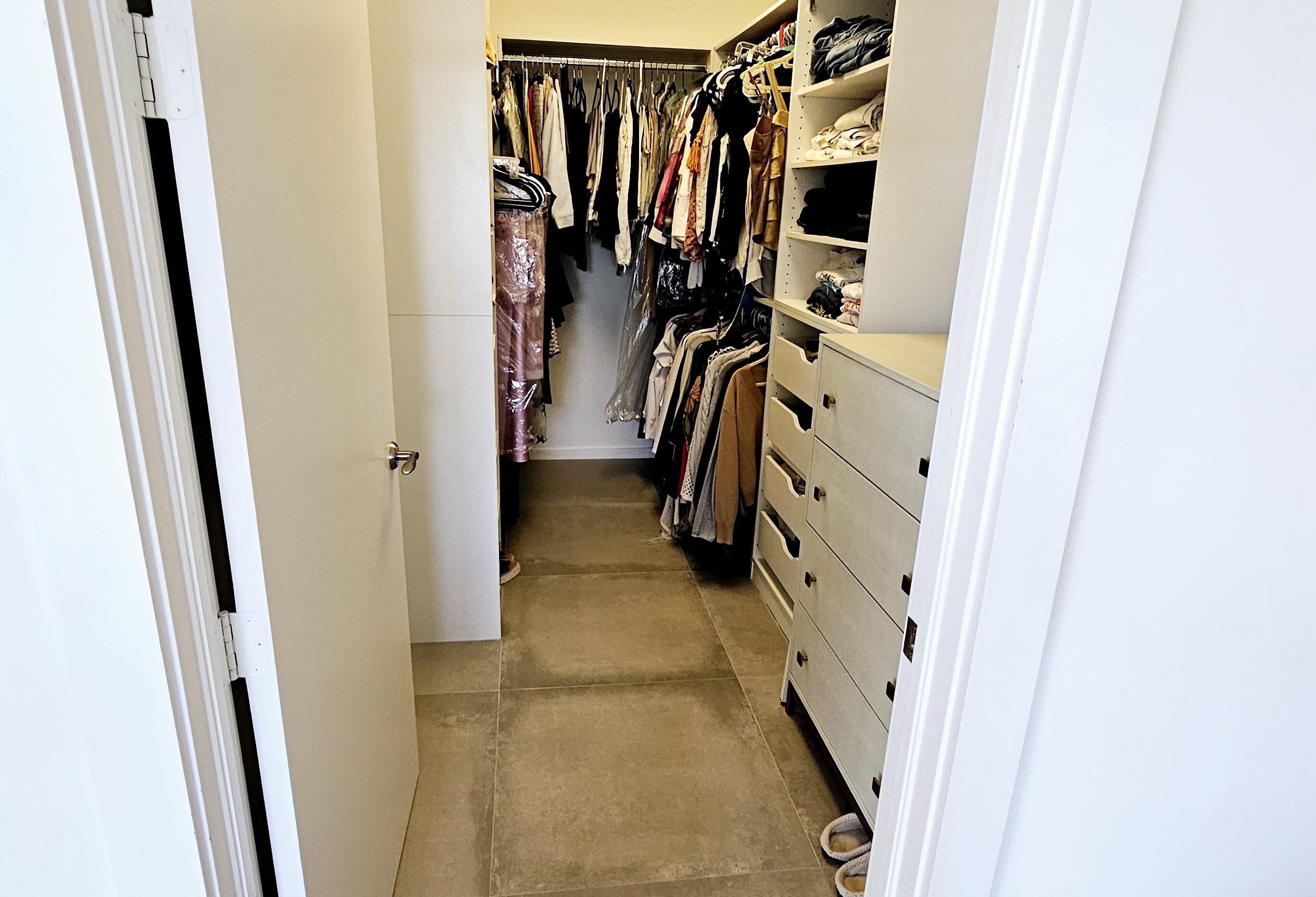 365 Southeast 6th Avenue, Unit 305 Delray Beach, FL 33483 - Photo 45 of 49 a view of walk in closet with clothes