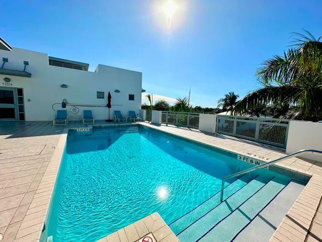 a view of a swimming pool with a patio